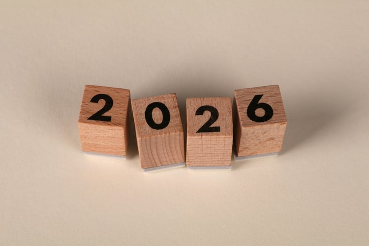 4 wooden blocks displaying one letter on each to make 